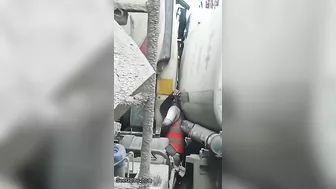 Man Trapped Between Trucks