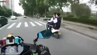 Motorcyclist Showing Middle Finger To Several People On Motorcycles