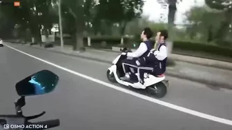 Motorcyclist Showing Middle Finger To Several People On Motorcycles