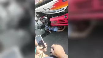 Motorcyclist Hits Moving Bus And Falls Face Down