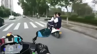 Motorcyclist Giving Middle Finger To Moped Driver