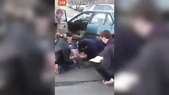 Nurse Performing CPR On Woman After Car Accident