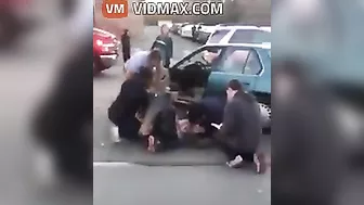 Nurse Performing CPR On Woman After Car Accident