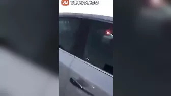 Nurse Performing CPR On Woman After Car Accident