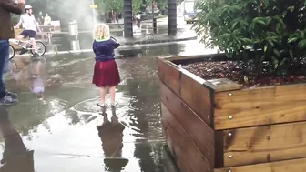 Terrifying moment a manhole cover explodes during flash floods