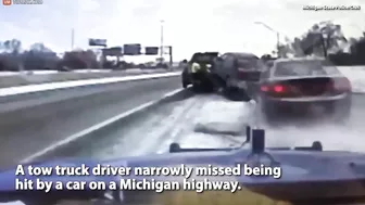 Tow Truck Driver Narrowly Misses Being Hit