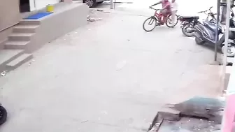 Two People Banging On A Bicycle