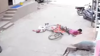 Two People Banging On A Bicycle