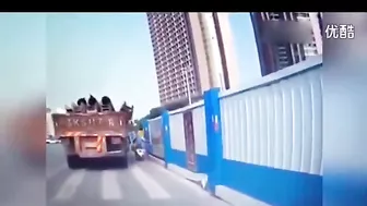 Unsecured heavy load falls off a truck and crushes a motorcyclist