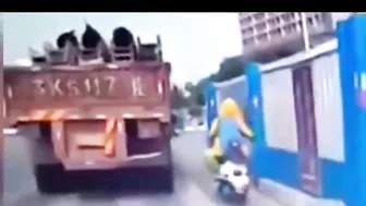 Unsecured heavy load falls off a truck and crushes a motorcyclist