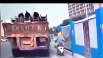 Unsecured heavy load falls off a truck and crushes a motorcyclist