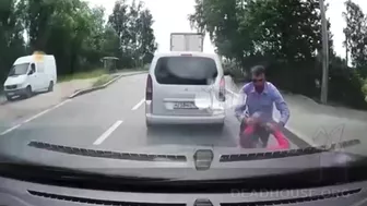 Useless Idiot Runs In Front Of Car Without Looking