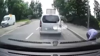 Useless dickhead runs in front of a car without looking