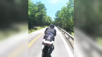 Cyclist Thrown Over Guardrail