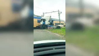 Passenger Train Hits Trapped Truck At Railway Crossing