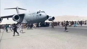 Afghans Frantically Climb Onto Plane As It Takes Off