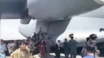 Afghans Frantically Climb Onto Plane As It Takes Off