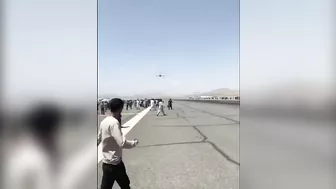 Afghans Frantically Climb Onto Plane As It Takes Off