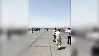 Afghans Frantically Climb Onto Plane As It Takes Off