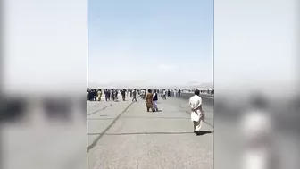 Afghans Frantically Climb Onto Plane As It Takes Off