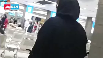 An Iranian Woman Removes The Headscarf From A Mullah's Head