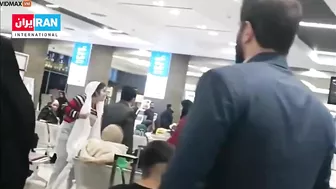 An Iranian Woman Removes The Headscarf From A Mullah's Head