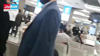 An Iranian Woman Removes The Headscarf From A Mullah's Head