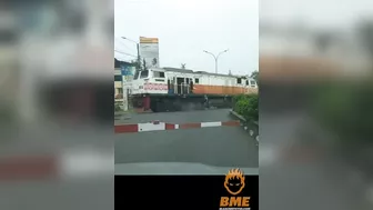 Cyclist Brakes While Crossing The Road In Front Of A Train