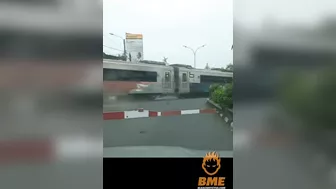 Cyclist Brakes While Crossing The Road In Front Of A Train