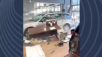 Guy Drives His Car Through The Dealership