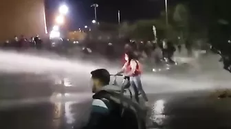 Protesters Defend Themselves With Water Cannons