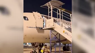 Ground Crew Dismantling Stairs