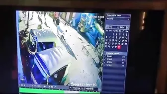 Man Sitting On A Box Of Burning Fireworks