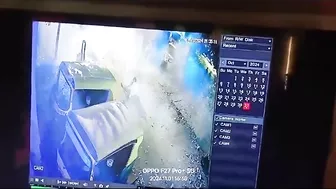 Man Sitting On A Box Of Burning Fireworks