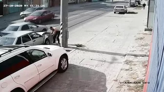 Man Jumps Onto Car Hood To Fix Dent