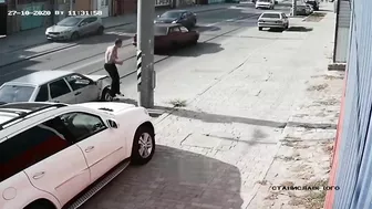 Man Jumps Onto Car Hood To Fix Dent