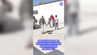 Mexican Band Plays Rocky In Street Fight