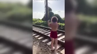 Idiot Girl Doing TikTok Stunt Near Railroad Tracks