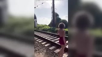 Idiot Girl Doing TikTok Stunt Near Railroad Tracks