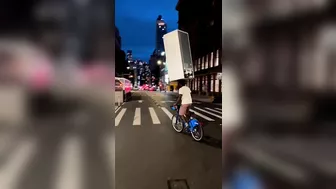 A Cyclist Carries A Refrigerator On His Head