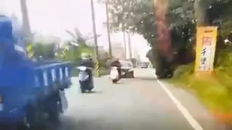 Motorcyclist Loses Control On Road