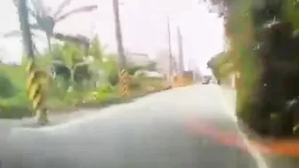 Motorcyclist Loses Control On Road