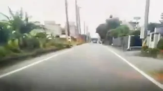 Motorcyclist Loses Control On Road