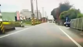 Motorcyclist Loses Control On Road