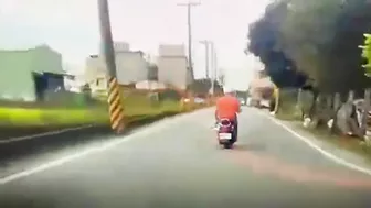 Motorcyclist Loses Control On Road