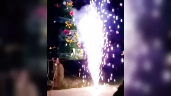 Fireworks Are Set Off On Both Sides Of The Glowing Christmas Tree
