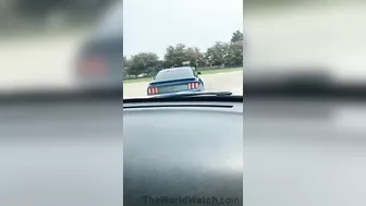 Showing Off His Car In A Mustang GT