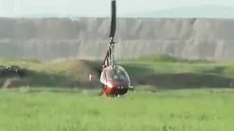 Small Helicopter Takes Off With Rotors Close To The Ground