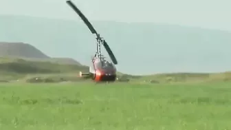 Small Helicopter Takes Off With Rotors Close To The Ground