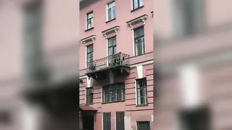 Toxic Couple Quarrels From Third Floor Balcony Onto Sidewalk
